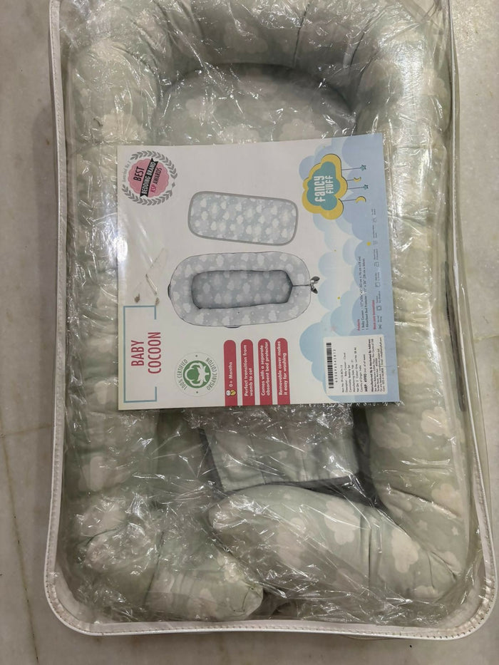 Mothercare Baby Cocoon with soft cushioned fabric, snug wrap design, and cozy support to keep newborns comfortable during sleep, rest, and travel.