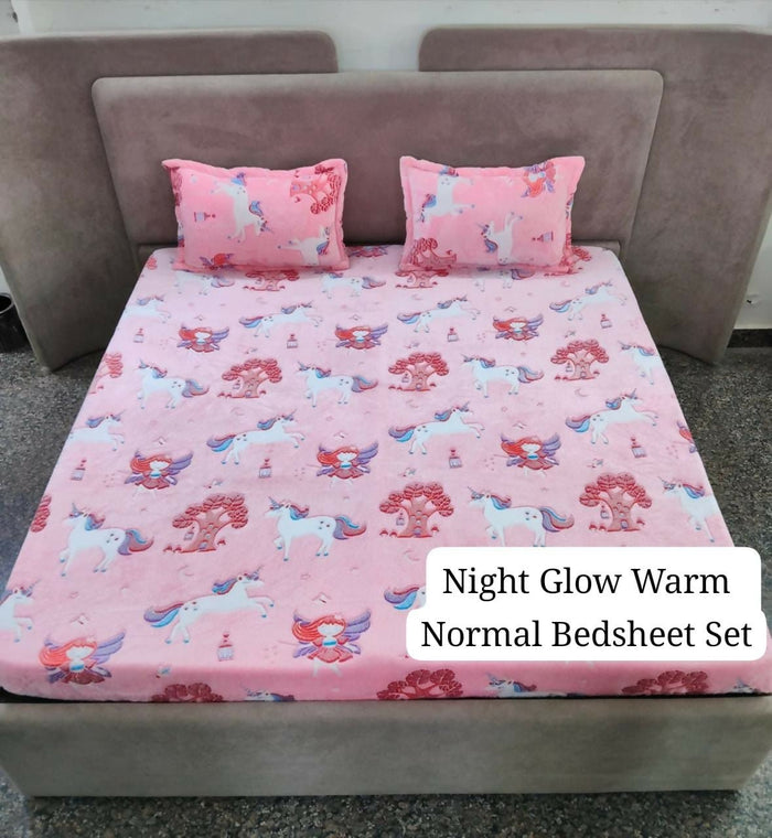 Pink unicorn-patterned bedsheet set on a bed with pillows.