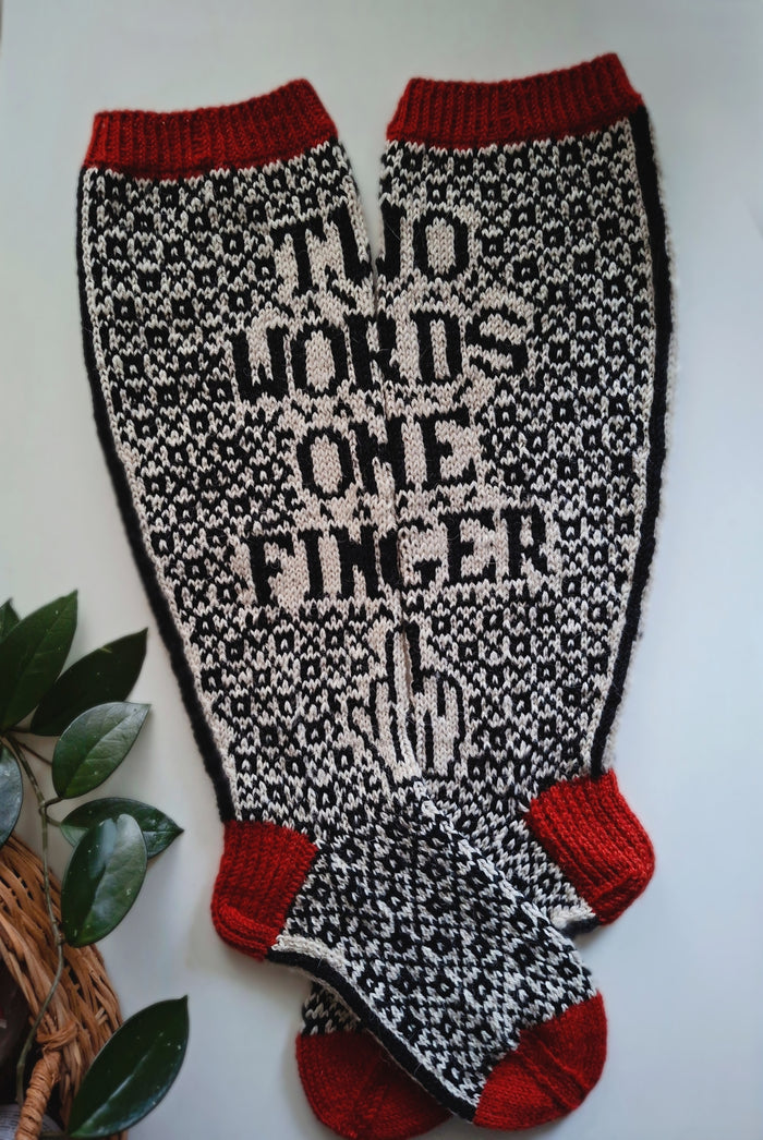 Socks with 'Two Words One Finger' text and red accents on a white background