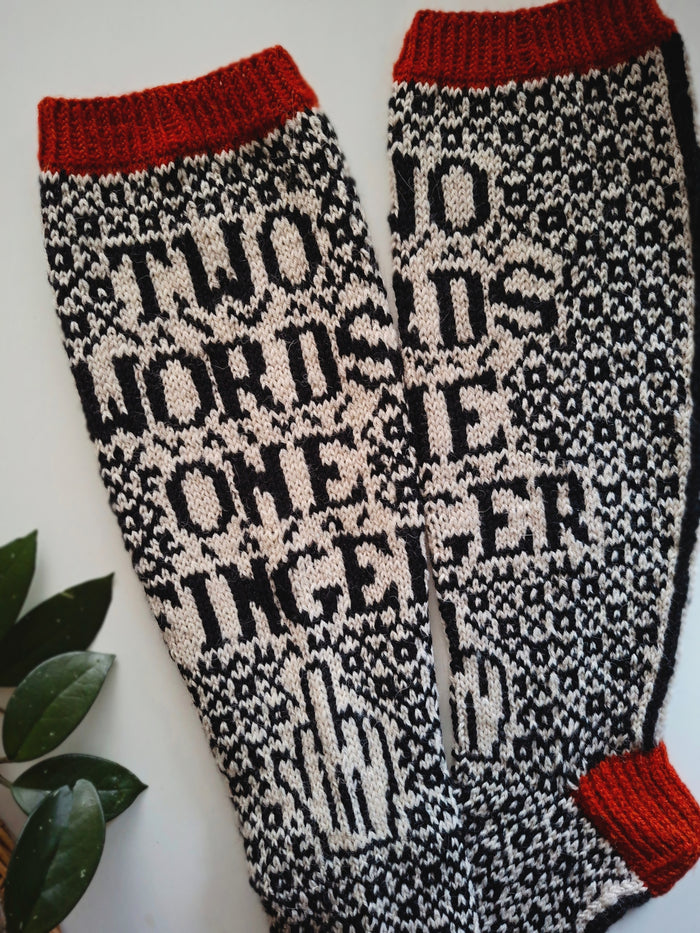 Knitted socks with text pattern on a white background