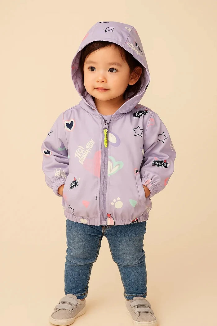 Child wearing a light purple jacket with colorful patches