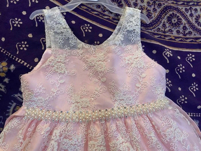 Adorn your baby girl in this elegant Pearl and Lace Work Frock, perfect for making precious memories!