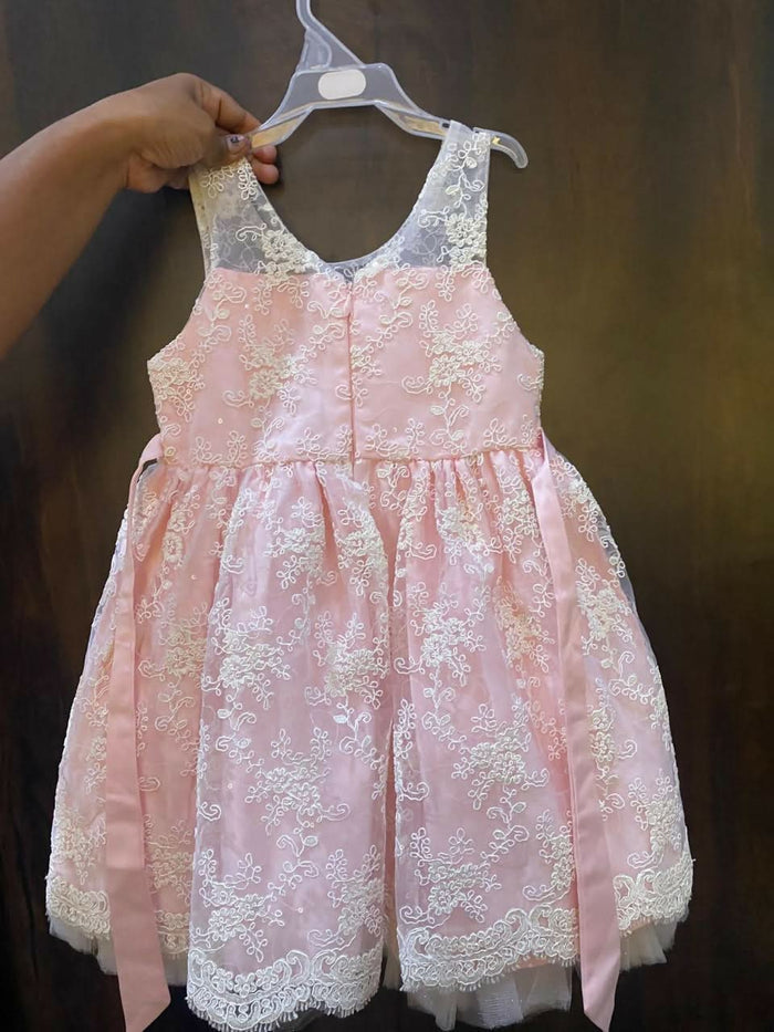 Adorn your baby girl in this elegant Pearl and Lace Work Frock, perfect for making precious memories!
