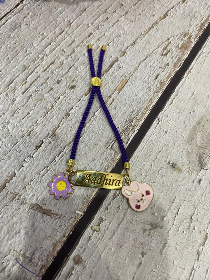 Personalized Bond Band Rakhi with charm featuring custom name personalization, decorative charm detail, comfortable band design, and a thoughtful keepsake for Raksha Bandhan celebrations.