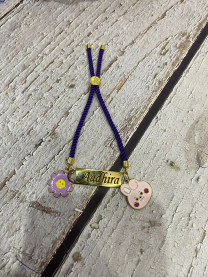 Personalized Bond Band Rakhi with charm featuring custom name personalization, decorative charm detail, comfortable band design, and a thoughtful keepsake for Raksha Bandhan celebrations.
