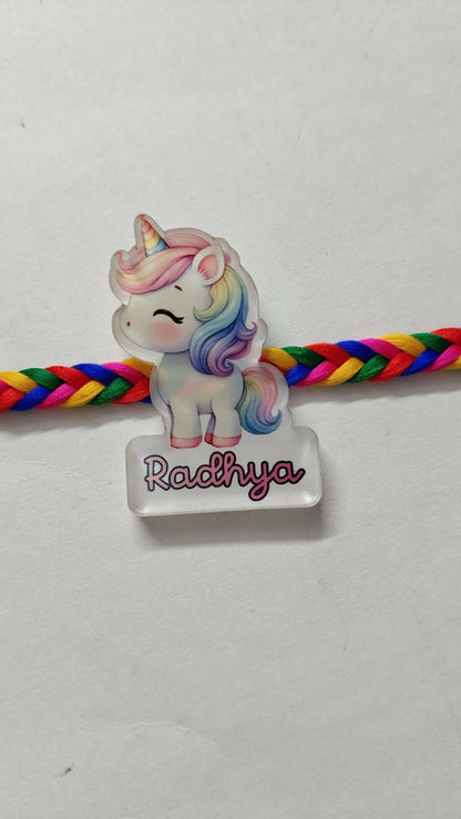 Personalized kids Rakhi featuring a custom name design, soft child-friendly materials, colorful embellishments, and a comfortable thread for celebrating Raksha Bandhan.