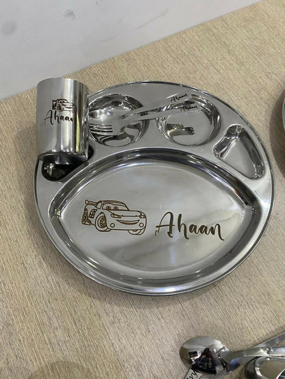 Name engraved baby feeding plate set with 5 sections, spoon, fork, and cup, durable stainless steel design.
