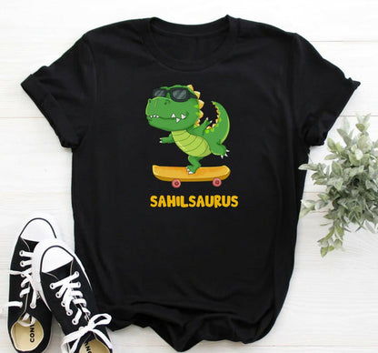 Black t-shirt with a cartoon dinosaur on a skateboard and 'Sahilsaurus' text, paired with black and white sneakers.