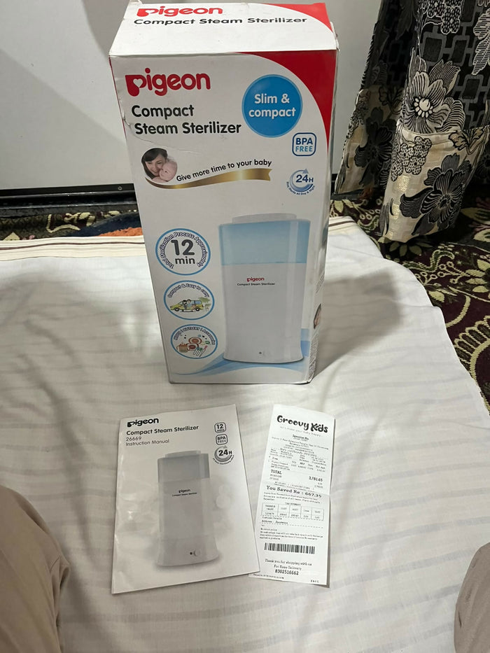 PIGEON Compact Steam Steriliser/Sterilizer for baby bottles and feeding accessories, featuring an efficient steam sterilization system, compact space-saving design, and convenient everyday use for maintaining feeding hygiene.