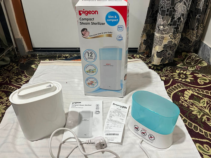 PIGEON Compact Steam Steriliser/Sterilizer for baby bottles and feeding accessories, featuring an efficient steam sterilization system, compact space-saving design, and convenient everyday use for maintaining feeding hygiene.
