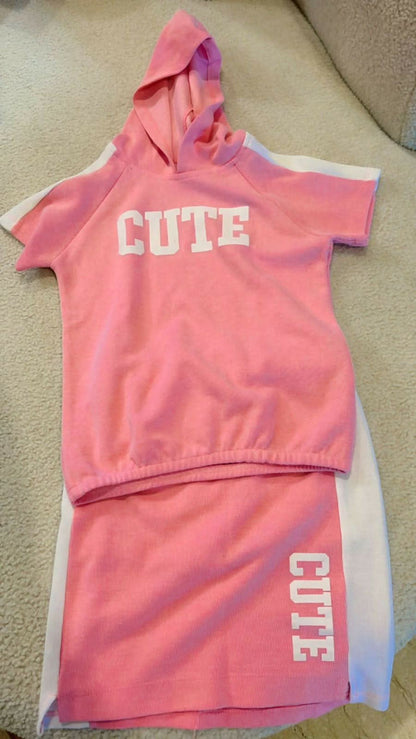 Shop now for the Pink T-shirt with Cap and Short Skirt set, offering comfort, style, and adorable charm for your baby’s everyday wear!