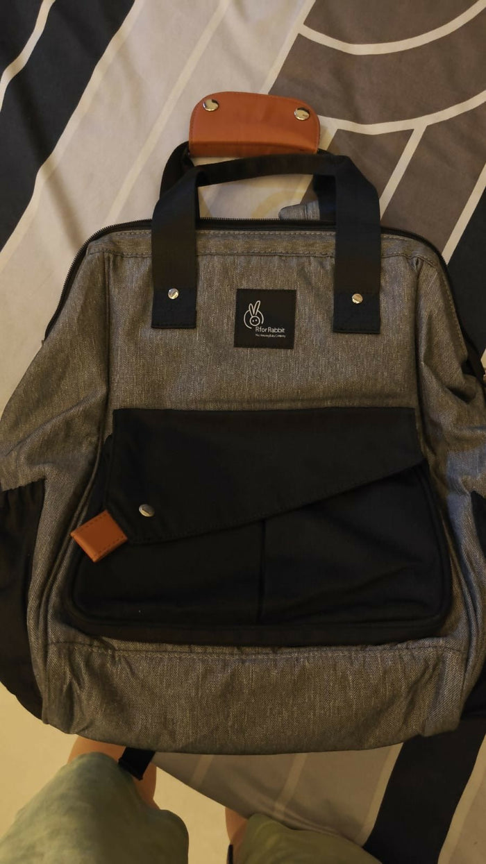 R for Rabbit Caramello Delight diaper bag for moms with multiple storage compartments, spacious design, comfortable carrying straps, and organized space for baby essentials.