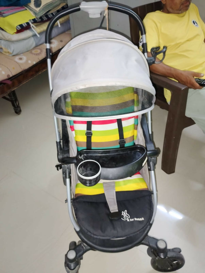 R for Rabbit Chocolate Ride toddler pram with reclining seat, foldable design, safety harness, adjustable canopy, smooth wheels, and comfortable travel support for babies and toddlers.