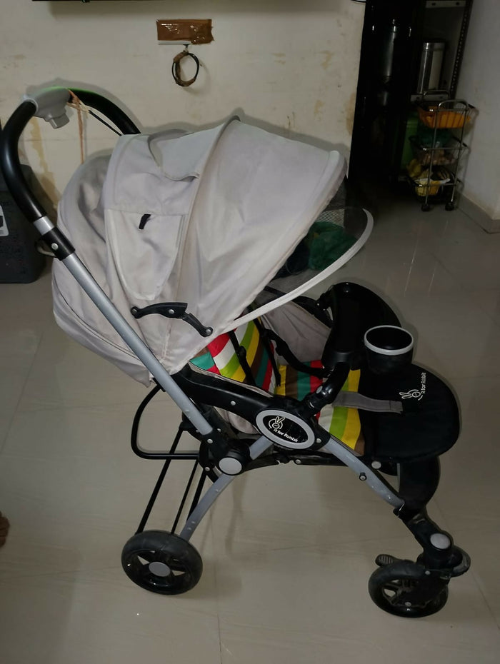 R for Rabbit Chocolate Ride toddler pram with reclining seat, foldable design, safety harness, adjustable canopy, smooth wheels, and comfortable travel support for babies and toddlers.
