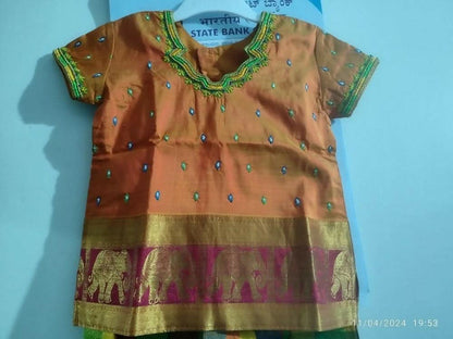 Dress your little girl in luxury and elegance with our Silk Lehenga and Blouse set, perfect for special occasions and celebrations.
