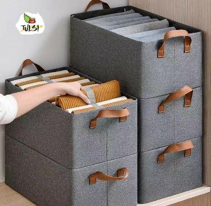 Gray storage boxes with brown handles on a wooden surface, featuring the Julsi brand logo.