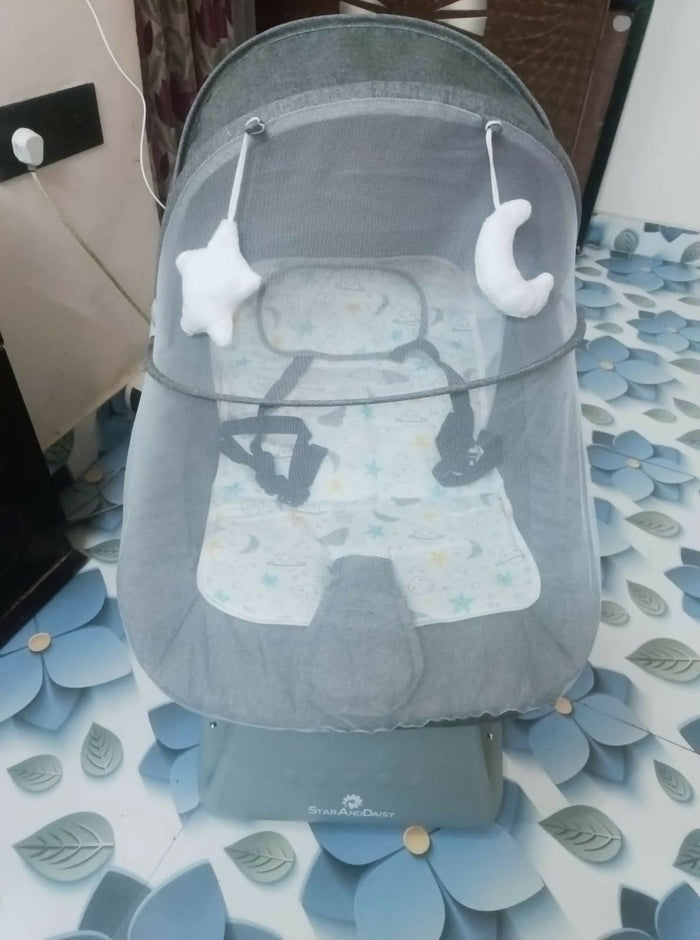 The Star & Daisy Electric Baby Swing is designed to provide a soothing and comfortable experience for your baby.