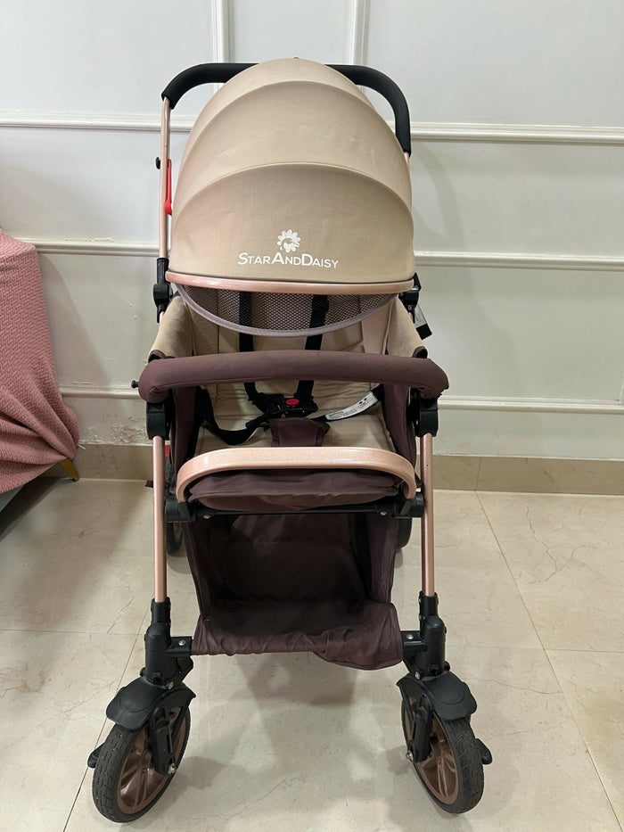 StarAndDaisy foldable baby stroller travel pram with reclining seat, sturdy wheels, safety harness, adjustable canopy, and compact foldable design for comfortable baby travel.