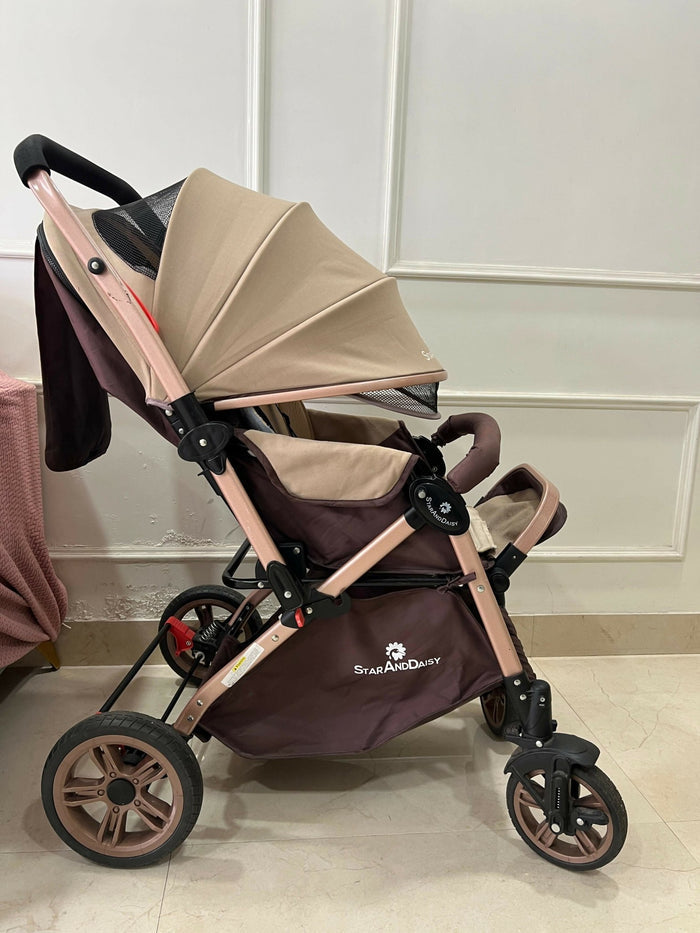 StarAndDaisy foldable baby stroller travel pram with reclining seat, sturdy wheels, safety harness, adjustable canopy, and compact foldable design for comfortable baby travel.