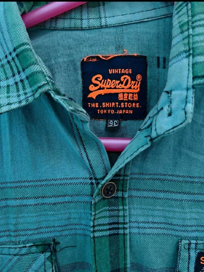 SUPERDRY Boys Shirt in Some Used condition, available in Delhi, featuring a stylish casual design, comfortable fit, and versatile look for everyday wear, outings, parties, and casual occasions.