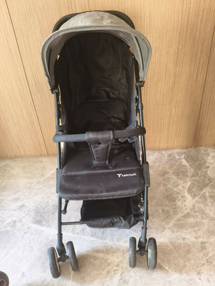 Black stroller with gray top